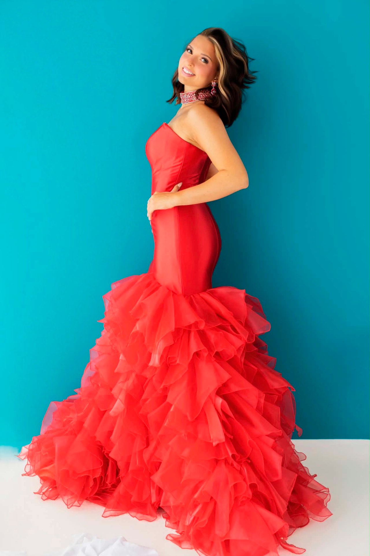 Red strapless mermaid prom gown with ruffled organza skirt