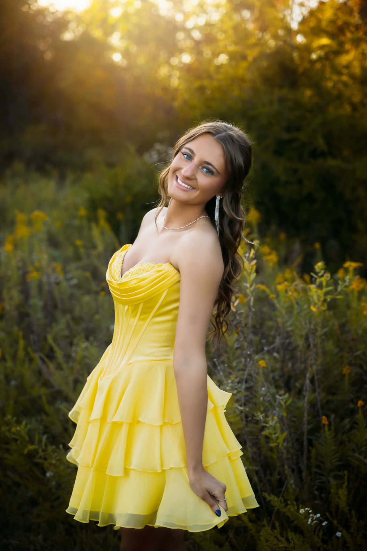 Prom dress in yellow ruffled chiffon at golden hour