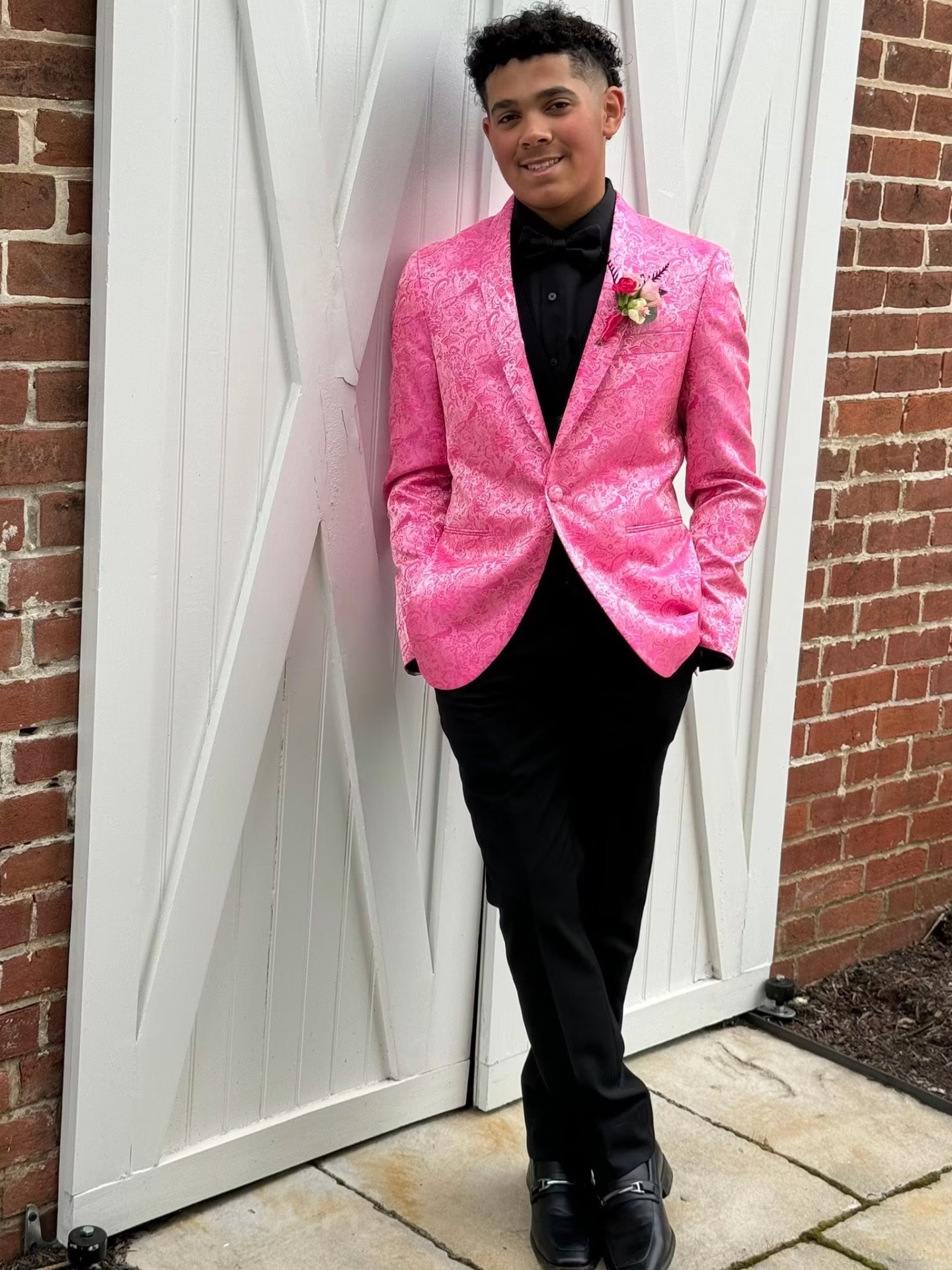 Prom-goer in pink paisley tuxedo jacket